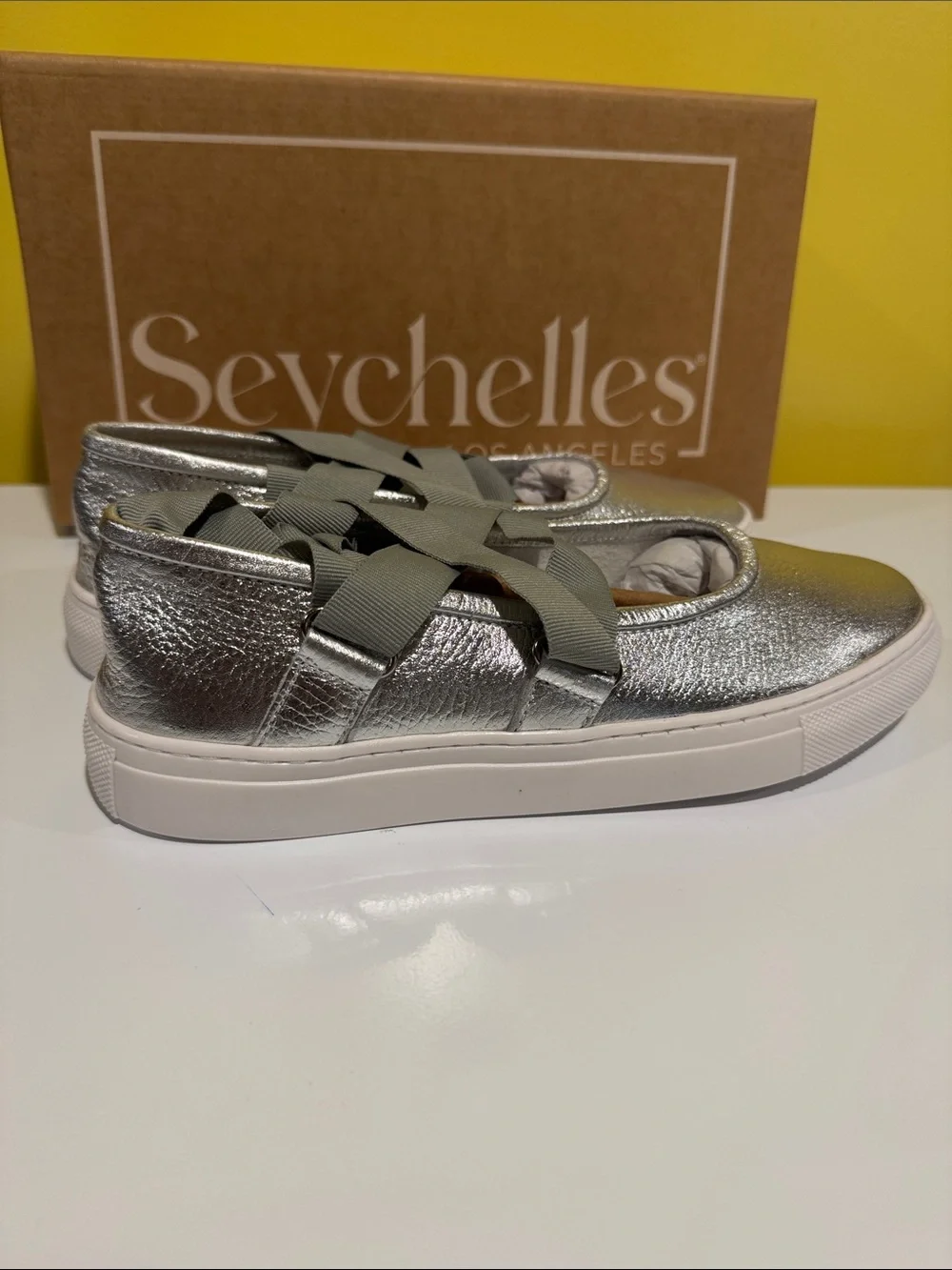 NIB Seychelles ribbons silver flats slip on .